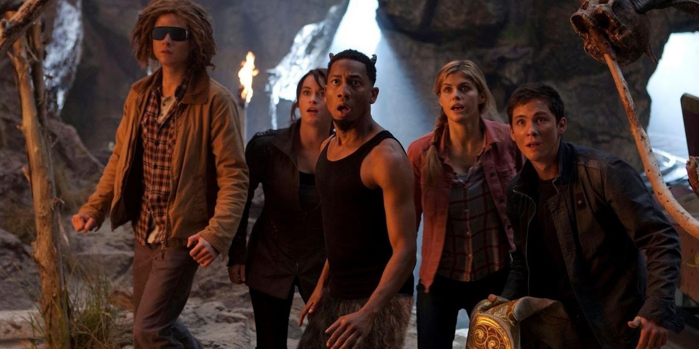 Tyson, Grover, Percy, and Annabeth in a cave in Percy Jackson.