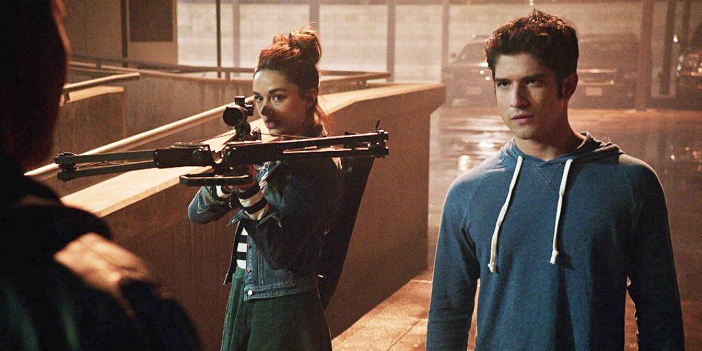 Allison standing next to Scott with a crossbow in Teen Wolf.