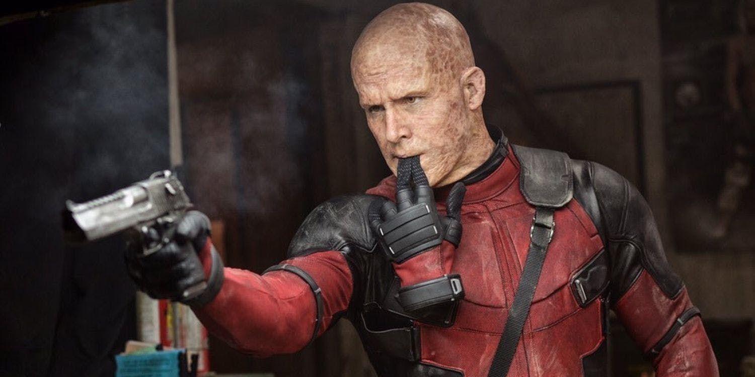 Ryan Reynolds as Deadpool with gun