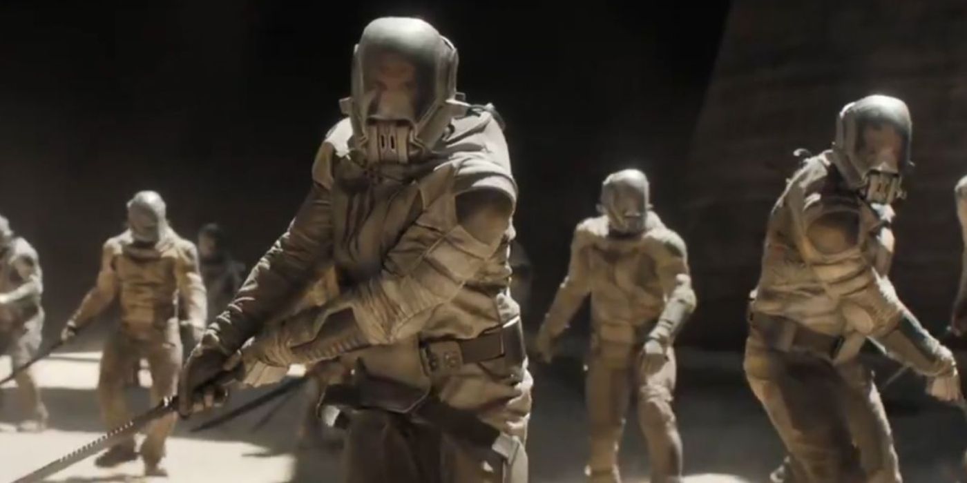 A group of the Sardaukar walking with their weapons out in Dune (2021).