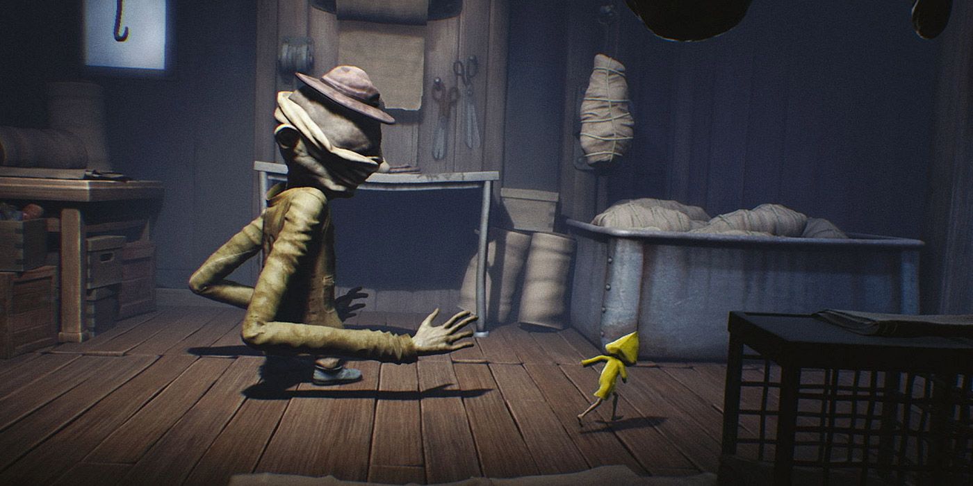 Six running away from a terrifying monster in Little Nightmares.