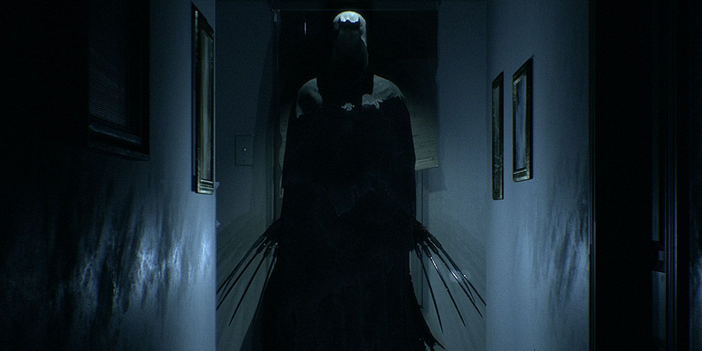 A terrifying monster with long claws in Visage, obscured in shadows at the end of a hallway.
