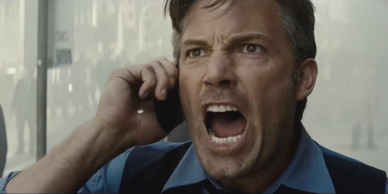 Bruce Wayne screams into the phone in Batman v Superman.