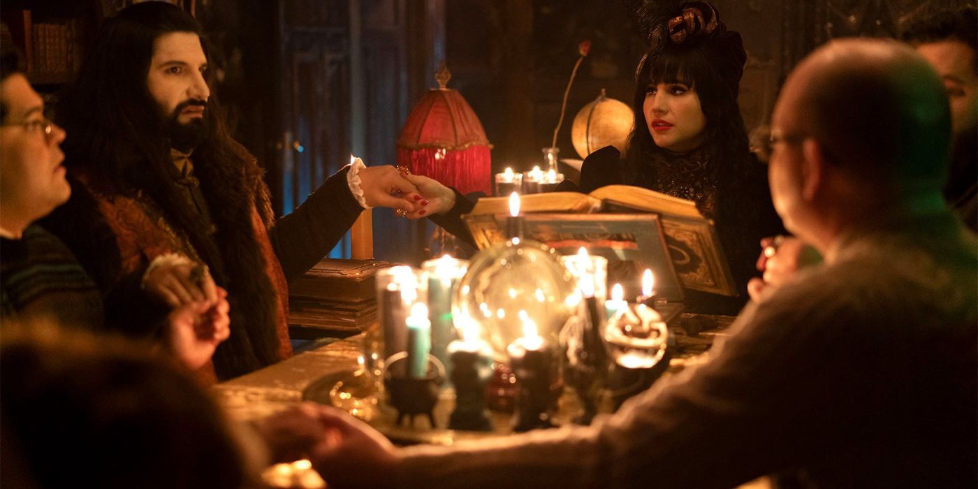 The vampires conducting a seance in What We Do In The Shadows.