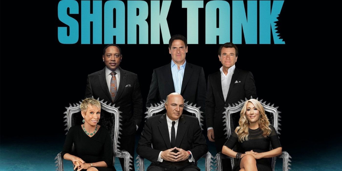 The judges and hosts under the Shark Tank logo