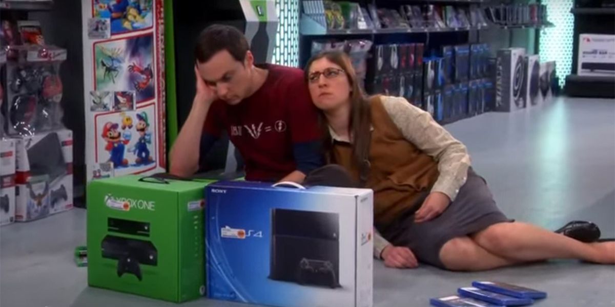 Sheldon sitting on the floor with his head in his hand and Amy sitting leaning against him in TBBT