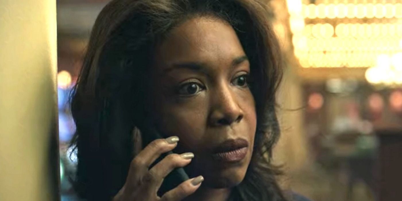 Special Agent Maya Miller in casino on phone looking concerned in Ozark