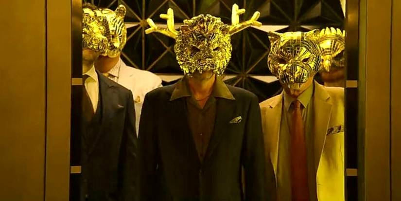 Squid Game VIPs in the Elevator wearing golden masks