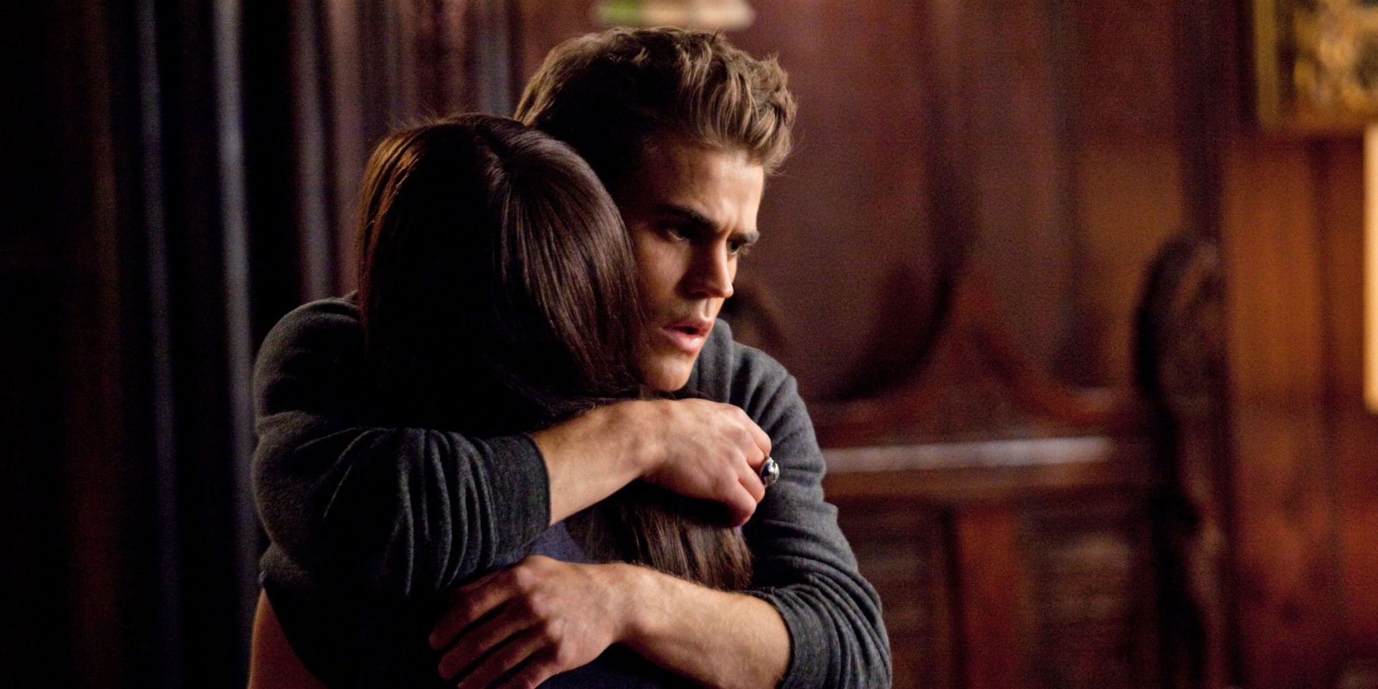 Stefan hugging Elena in The Vampire Diaries.