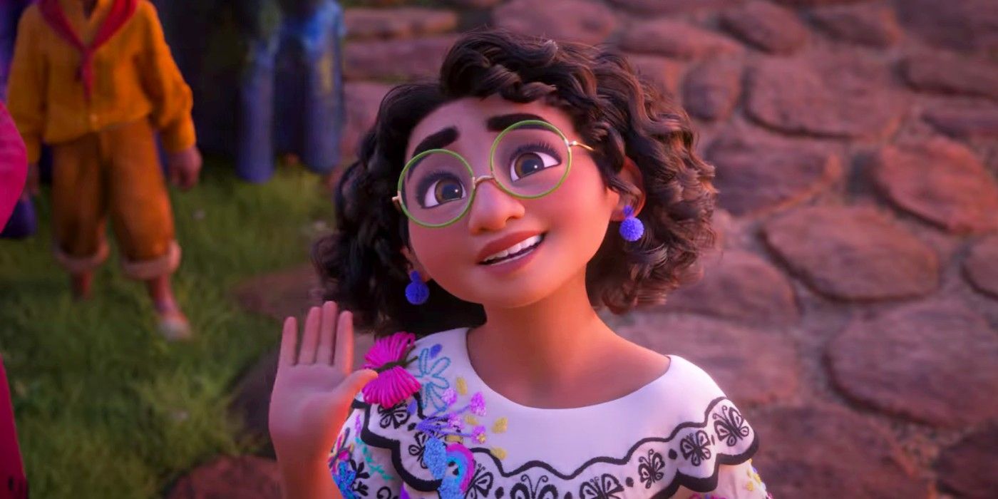 Mirabel raises her hand and smiles in Disney's Encanto