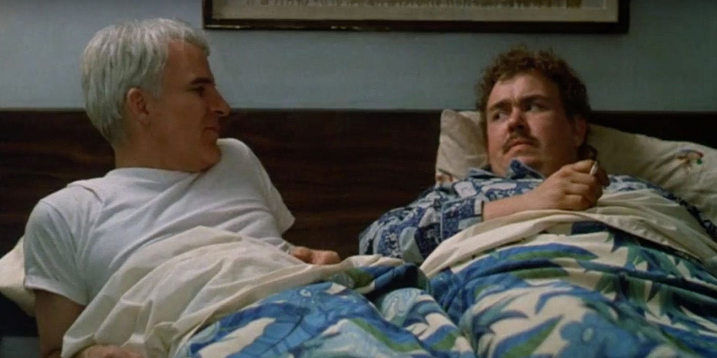 Steve Martin and John Candy in bed in Planes Trains and Automobiles.