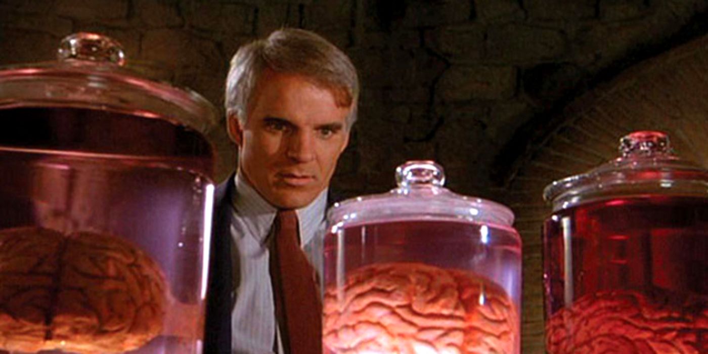 Steve Martin looking at a brain in a jar.