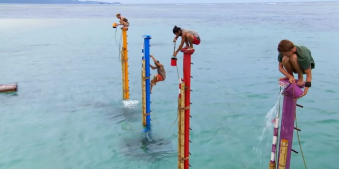 Four contestants standing on poles at sea in Survivor Cagayan