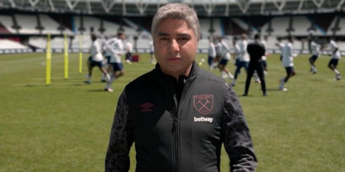 Nate on the West Ham field in a coaching uniform in Ted Lasso