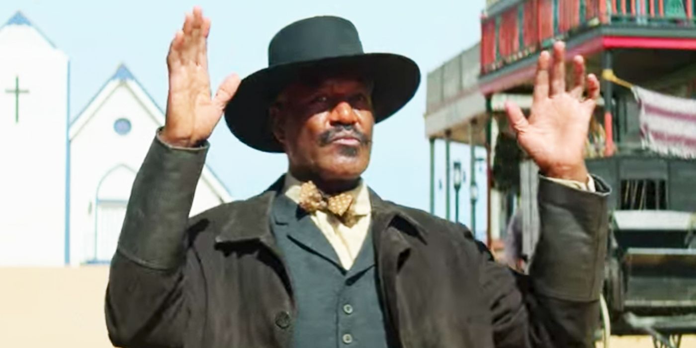 Bass Reeves raising his hands in The Harder They Fall