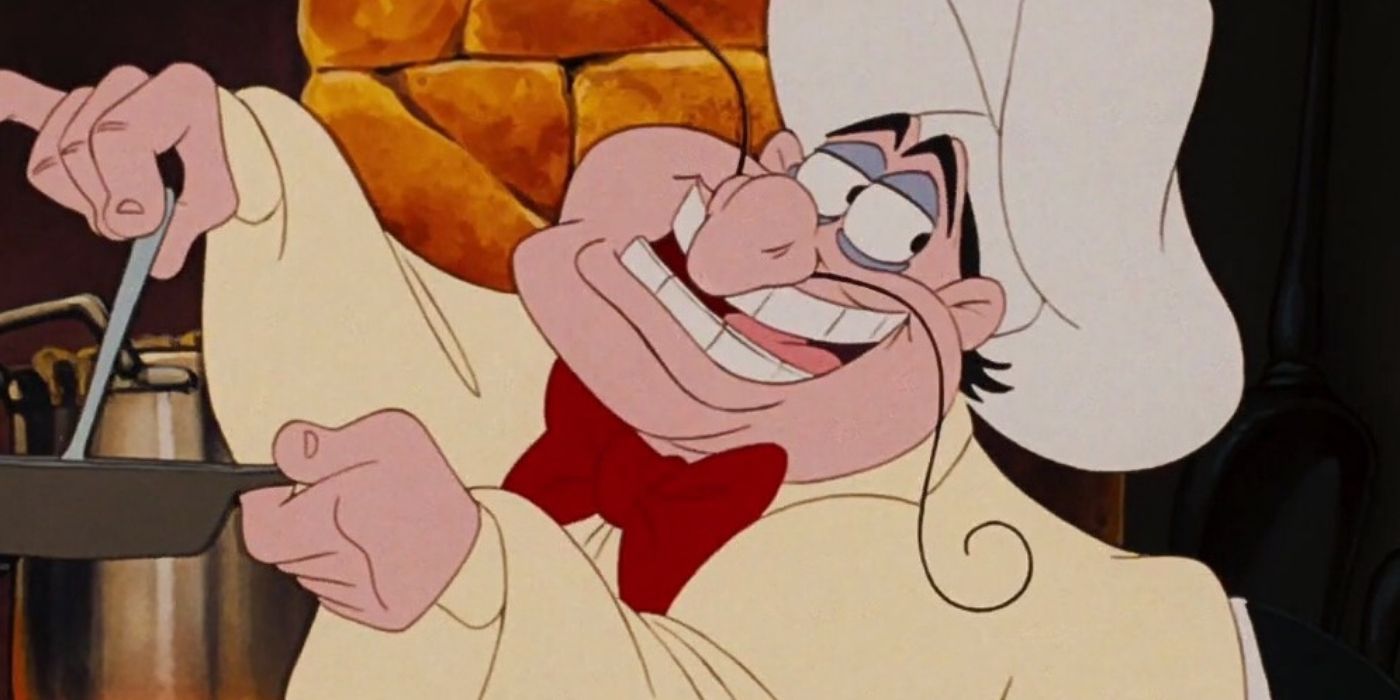 Chef Louis smiling while cooking in The Little Mermaid