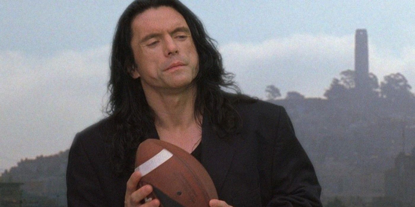 Tommy Wiseau holds a football in The Room