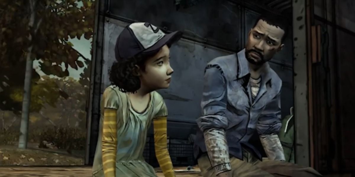 Lee and Clementine in a boxcar in The Walking Dead video game.