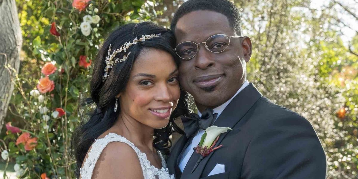 Beth &amp; Randall smiling for a picture on their wedding day in This Is Us