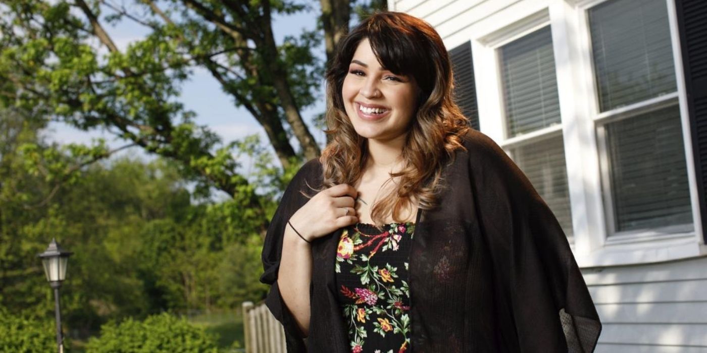 Tiffany Franco from 90 Day Fiancé The Other Way promo shot smiling wearing black floral top