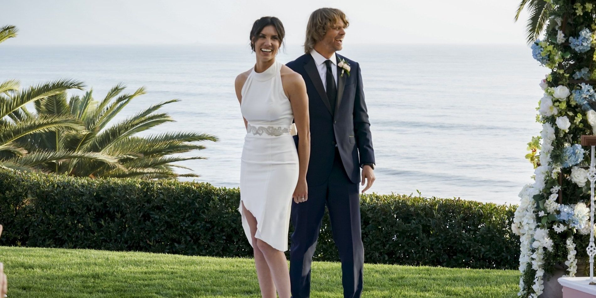 Kensi and Deeks standing next to each other on their wedding day in NCIS: Los Angeles