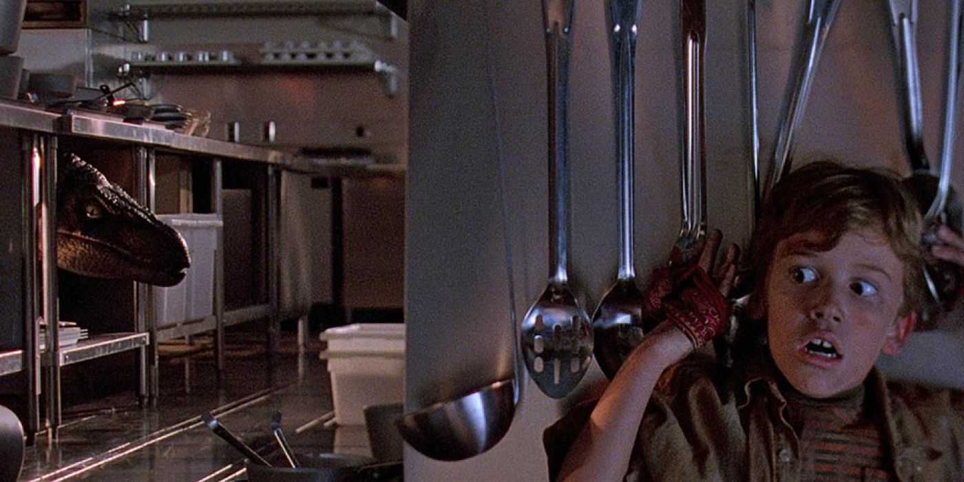 Tim hiding from a dinosaur in the kitchen in Jurassic Park.