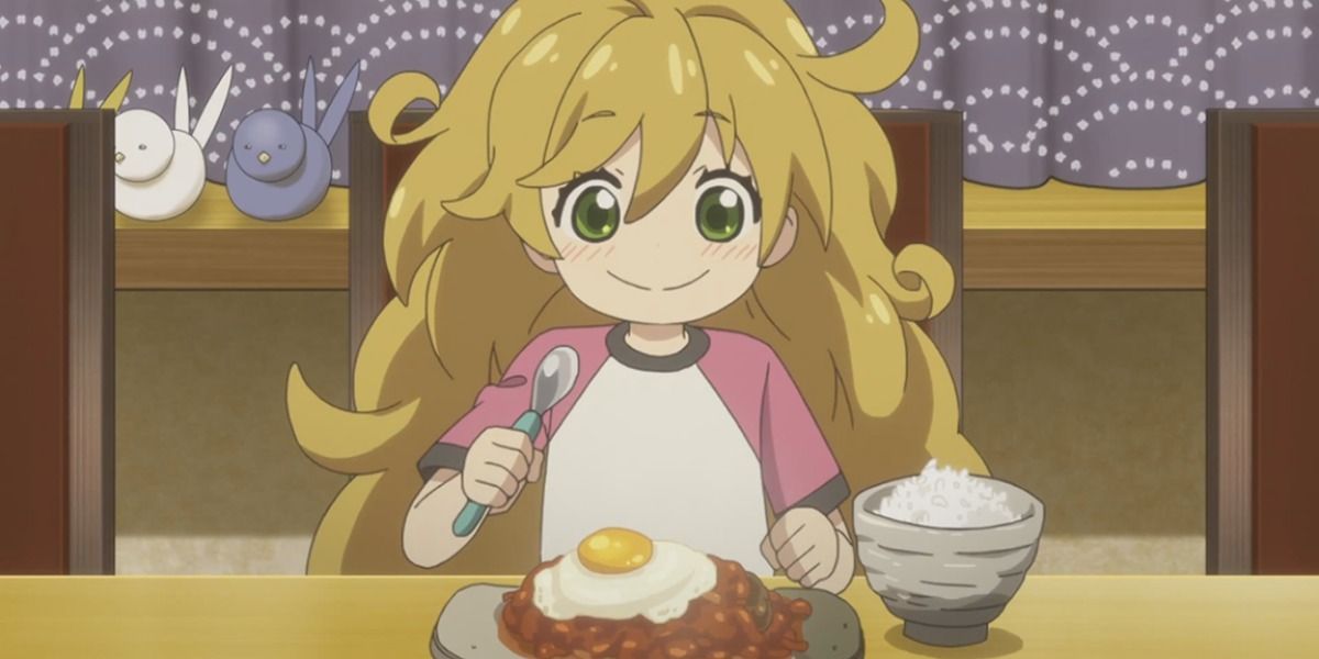 Tsumugi in Sweetness and Lightning digging into a hamburger steak and rice