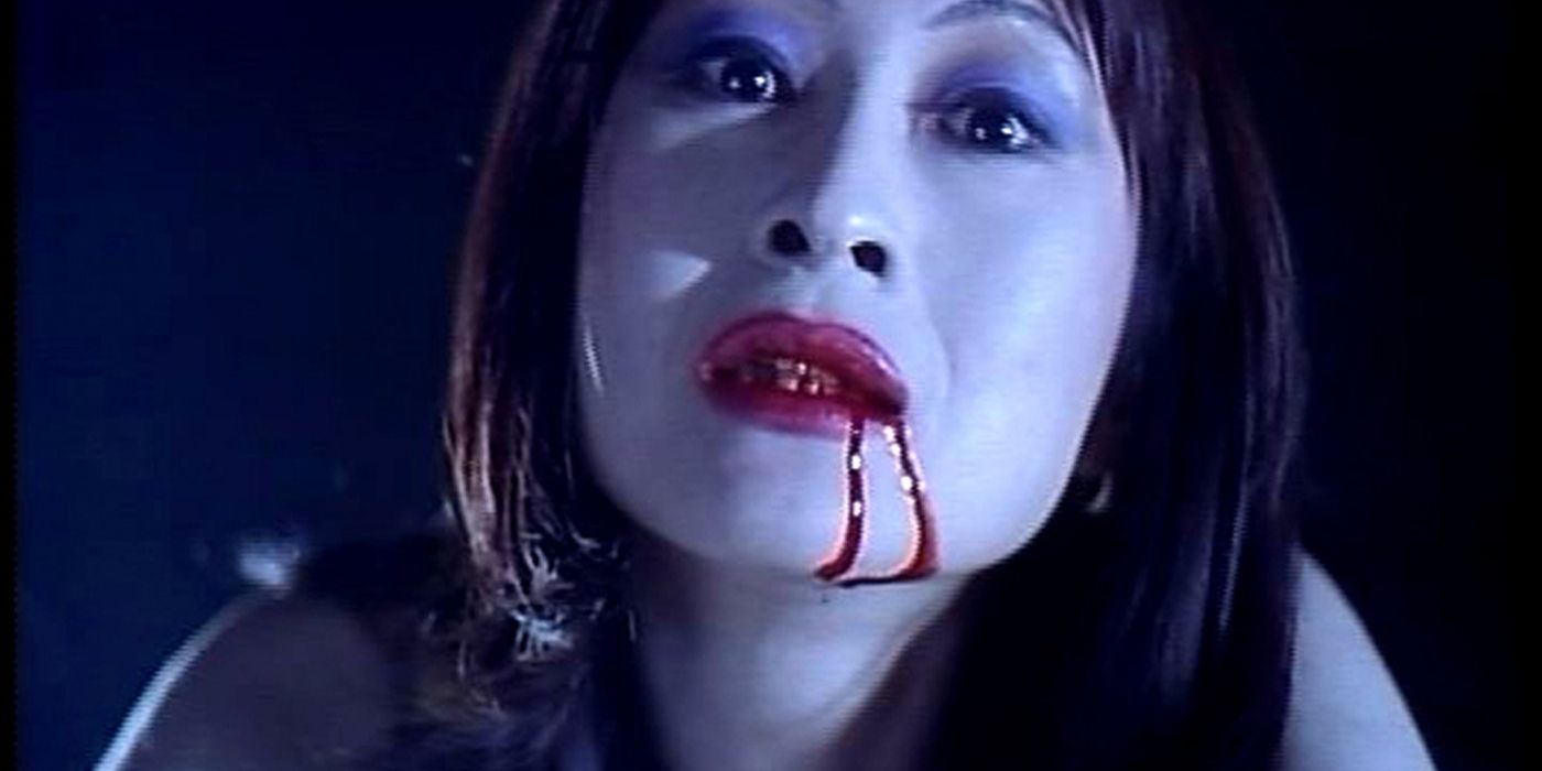 A woman with blood on her lips in the japanese horror movie Twilight Dinner
