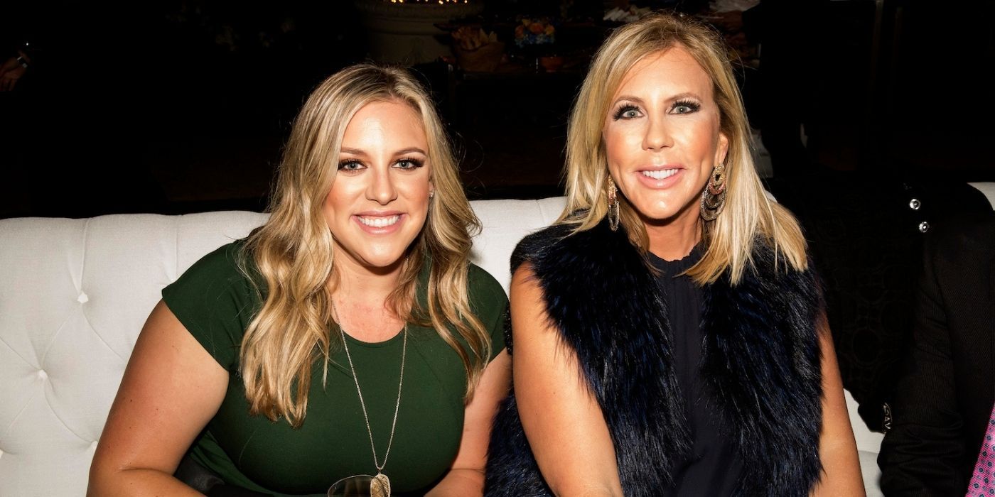 Vicki and her daughter posing for a camera at a RHOC party