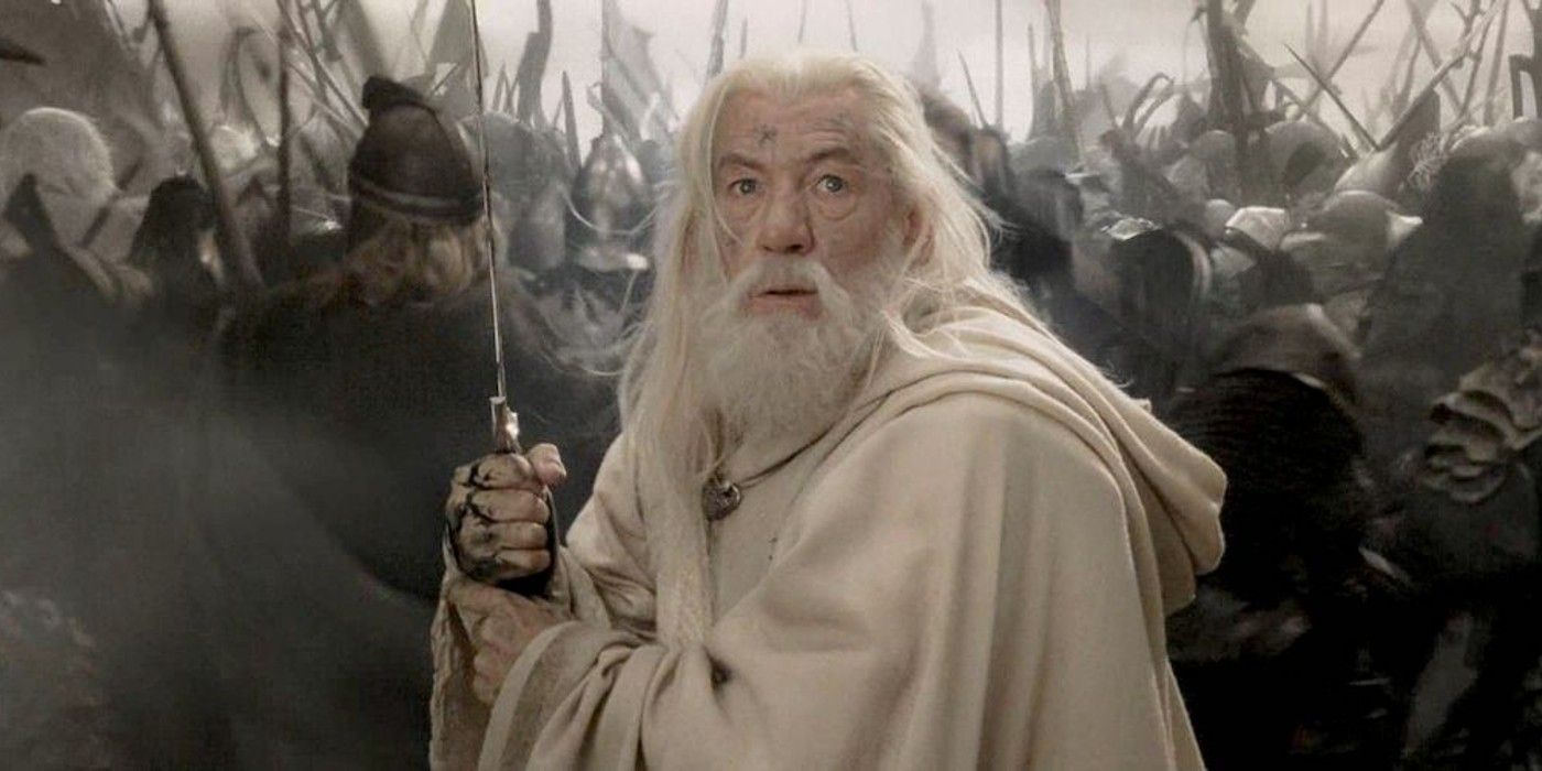 Gandalf the White holding a sword in the battlefield in The Return of the King