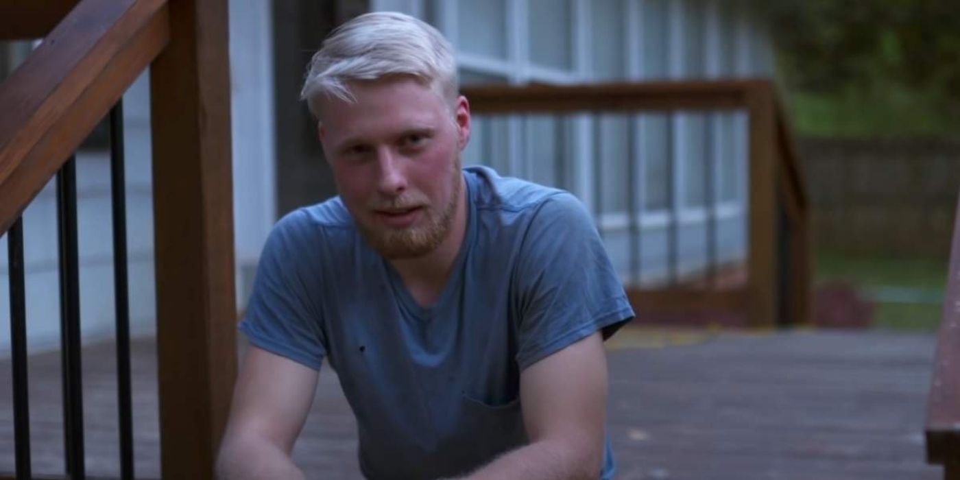 Ethan Plath from Welcome to Plathville sitting on porch looking serious