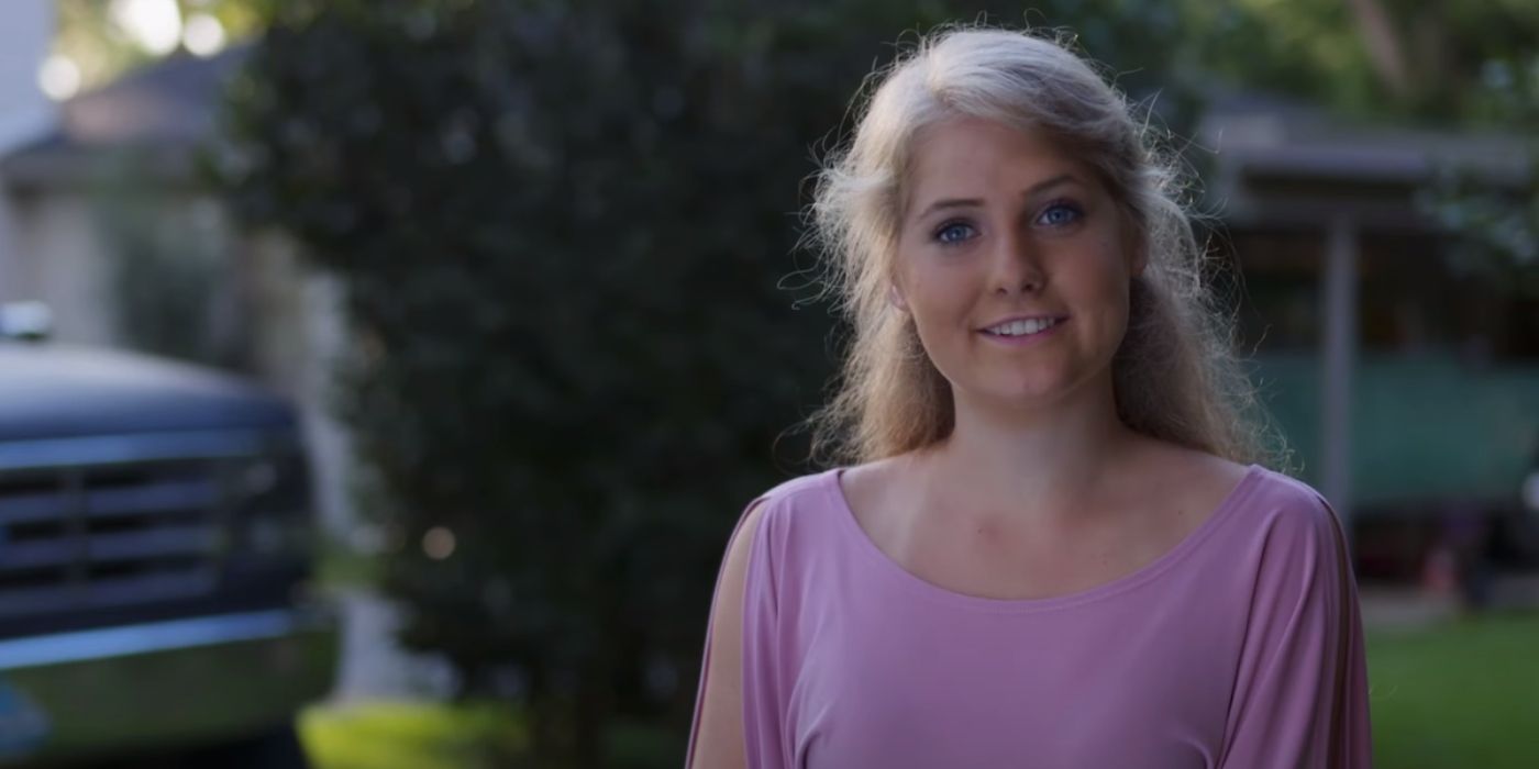 Welcome to Plathville Lydia Plath talking to camera outside smiling and wearing a purple top.