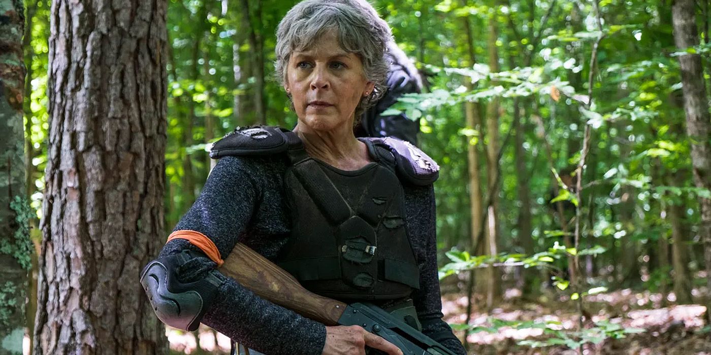 Carol walking through the woods in The Walking Dead.