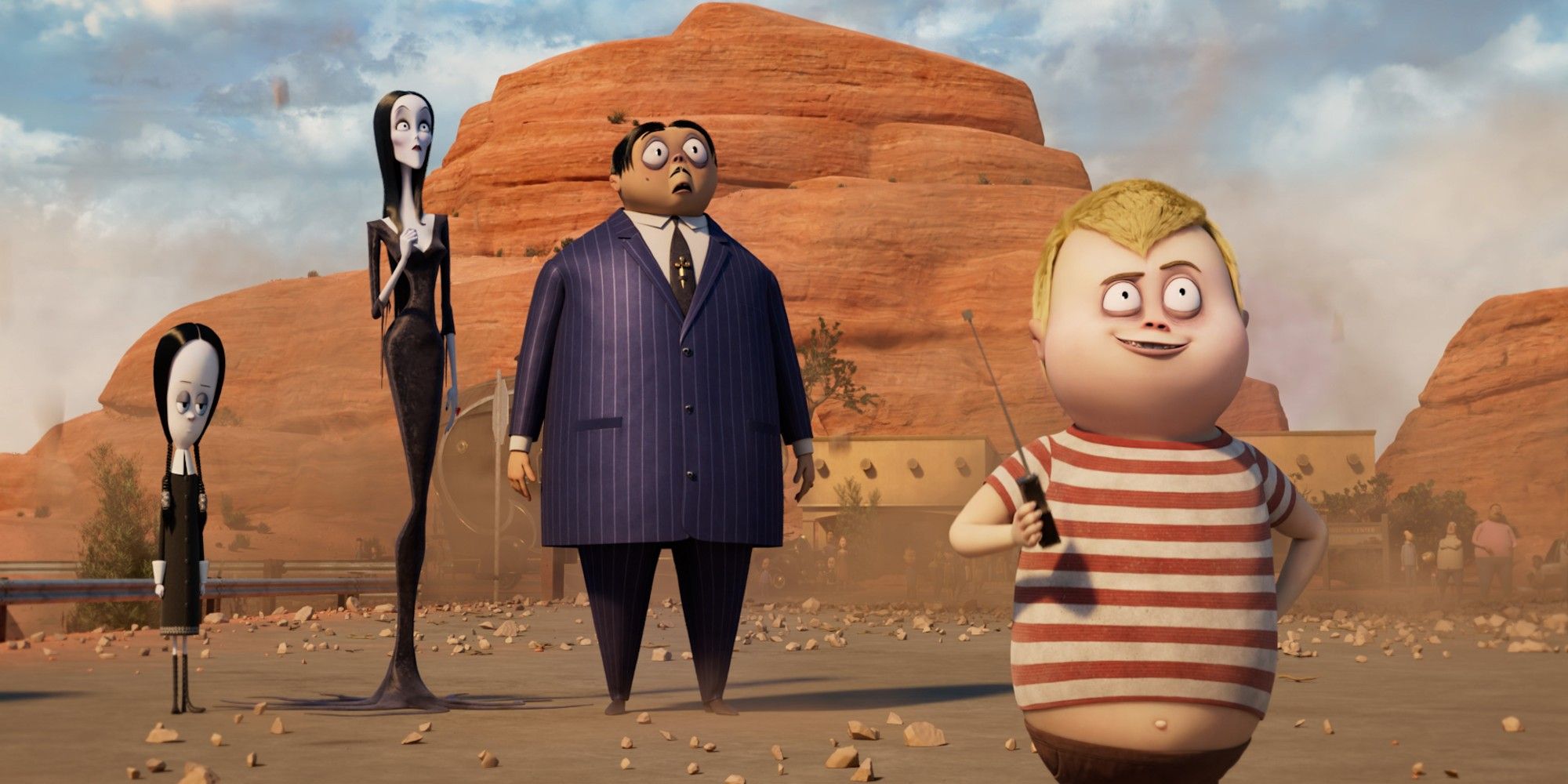 Wednesday, Morticia, Gomez and Pugsley stand in the desert in The Addams Family 2.
