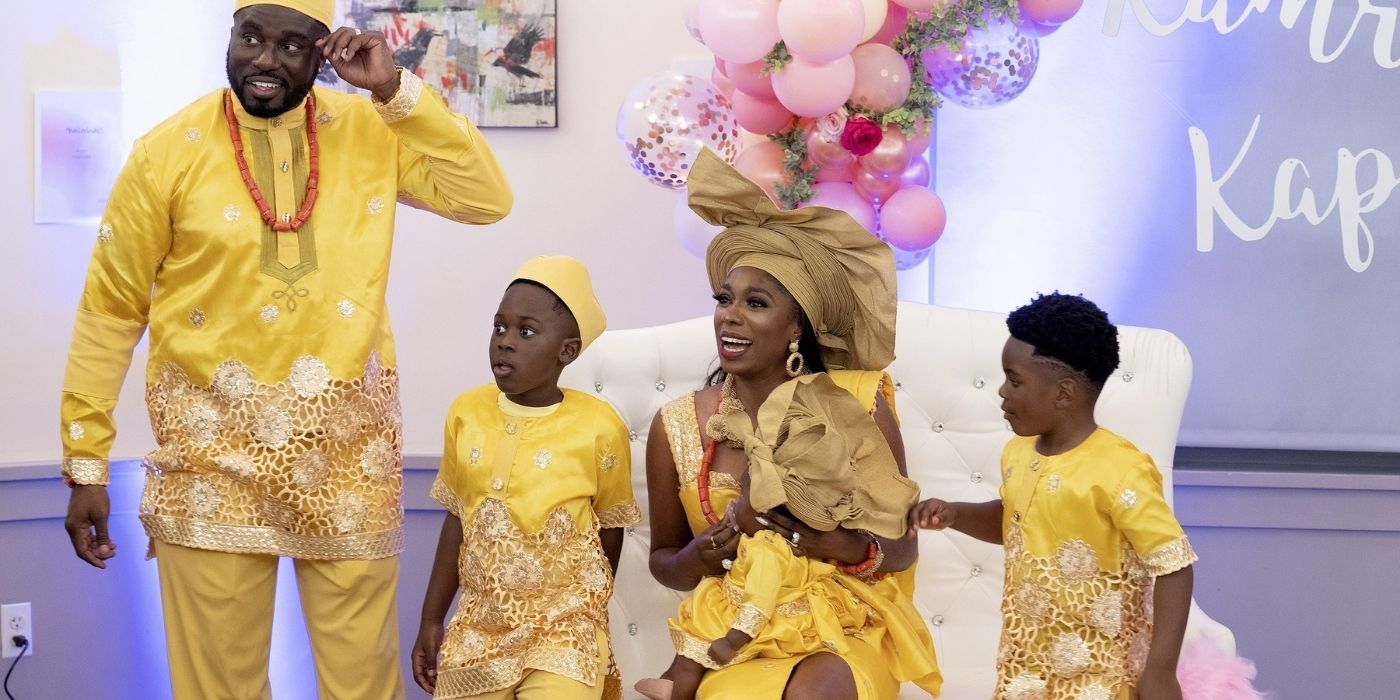 Wendy Osefo posing with her three kids and husband in a scene on RHOP