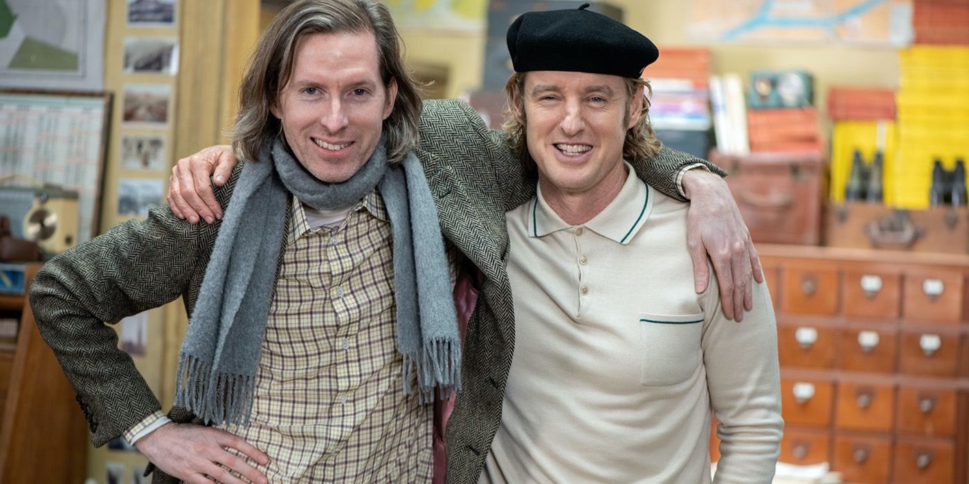 Wes Anderson poses with Owen Wilson behind the scenes of The French Dispatch