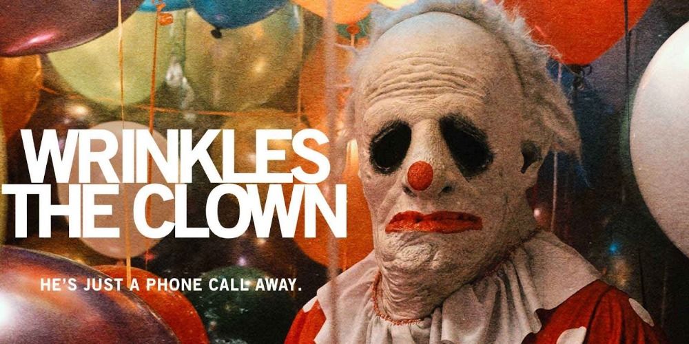 Wrinkles The Clown written in white next to picture of clown in front of balloons with He's just a phone call away under it in white