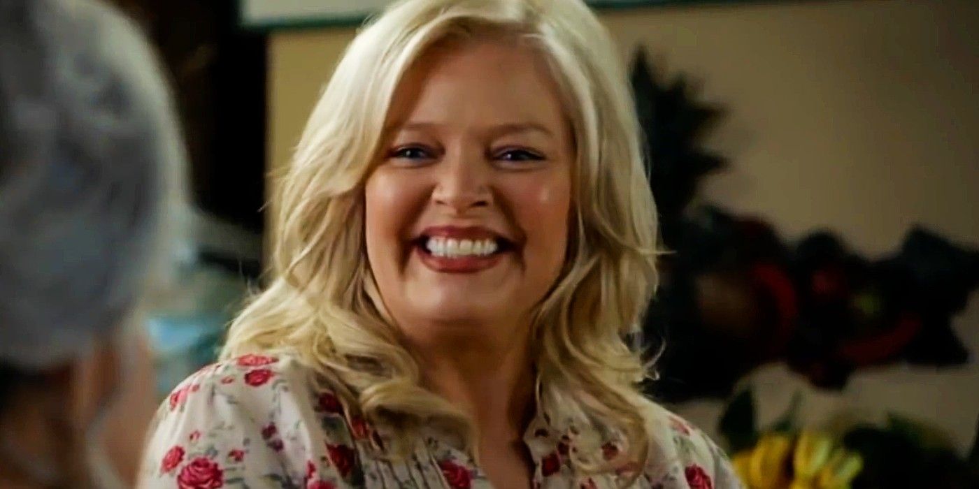 Brenda Sparks smiling widely in a scene from Young Sheldon.