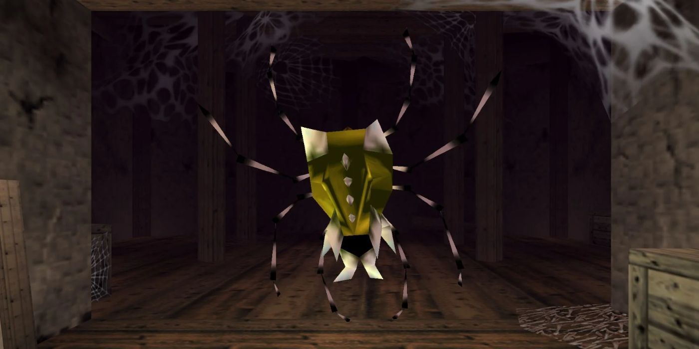 A Gold Skulltula spider hangs from the ceiling in Ocarina of Time.