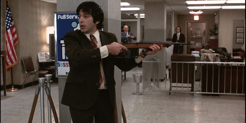 Sonny points a rifle in Dog Day Afternoon