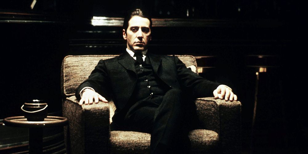 Michael sits in a throne-like chair in The Godfather