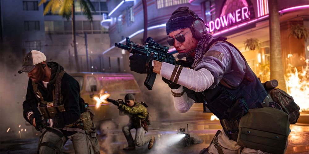 Solider shoots machine gun in front of neon sign in Call of Duty: Black Ops: Cold War