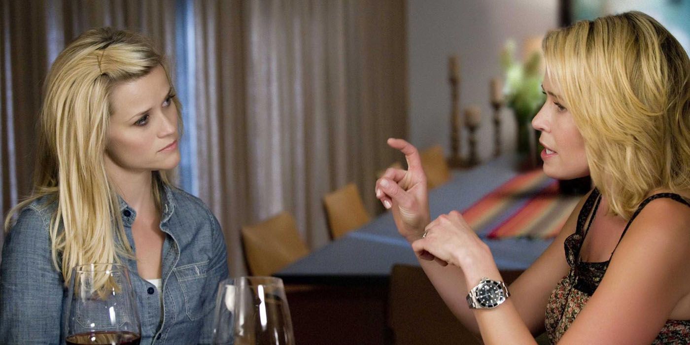 Reese Witherspoon and Chelsea Handler sitting at a table together in a scene from This Means War.