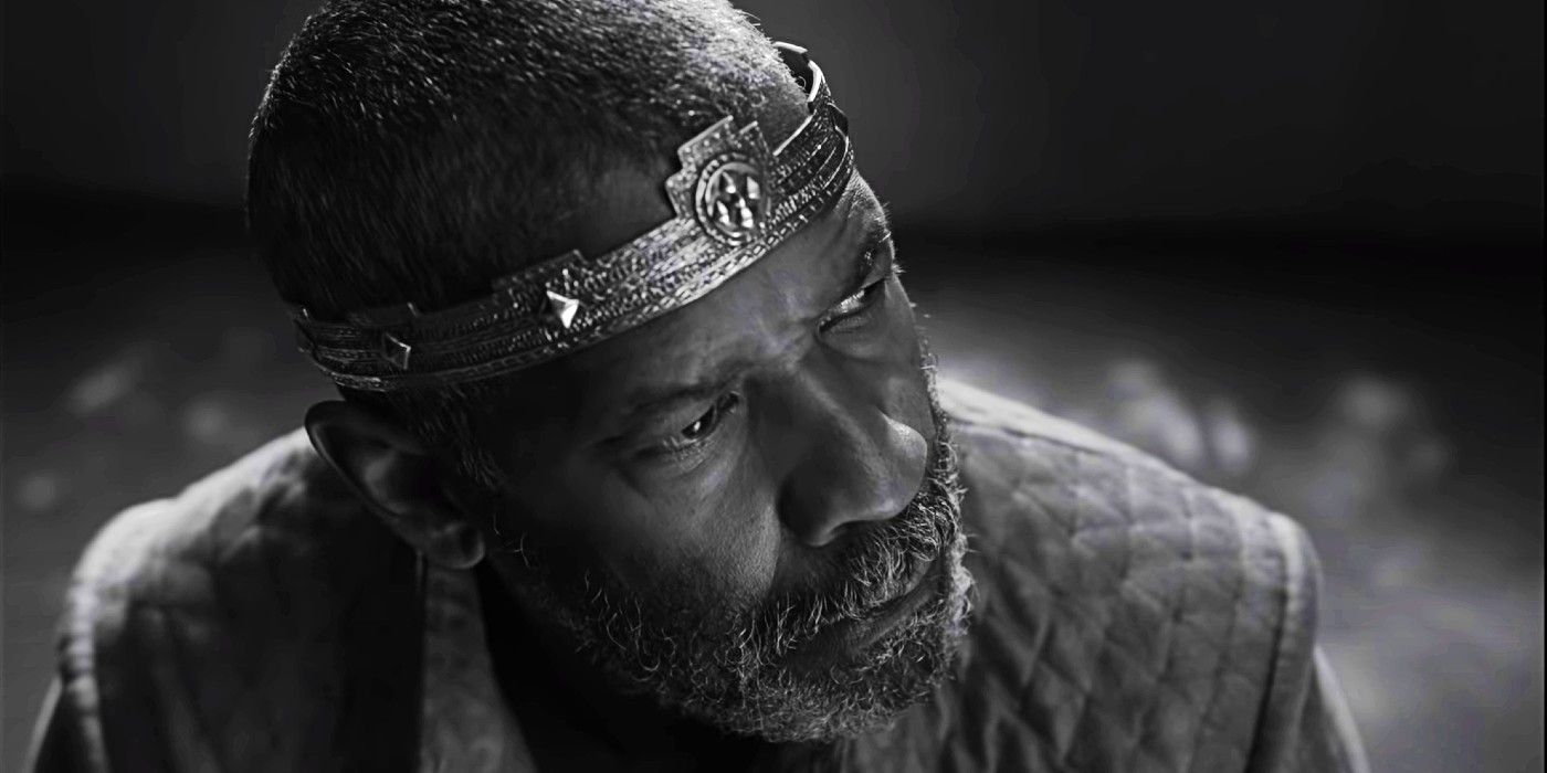 Denzel Washington, as Lord Macbeth, sits and looks to the side in The Tragedy of Macbeth