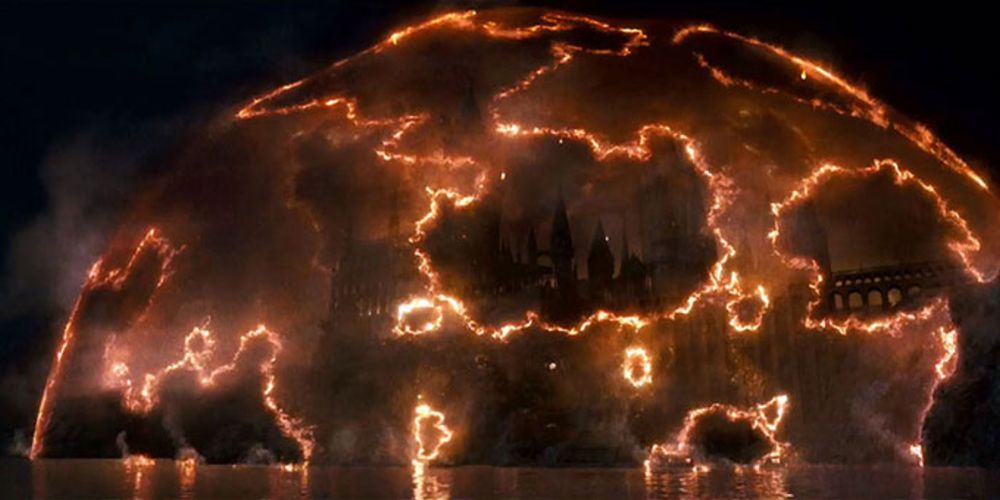 Hogwarts protected by a dome of fire in Harry Potter.