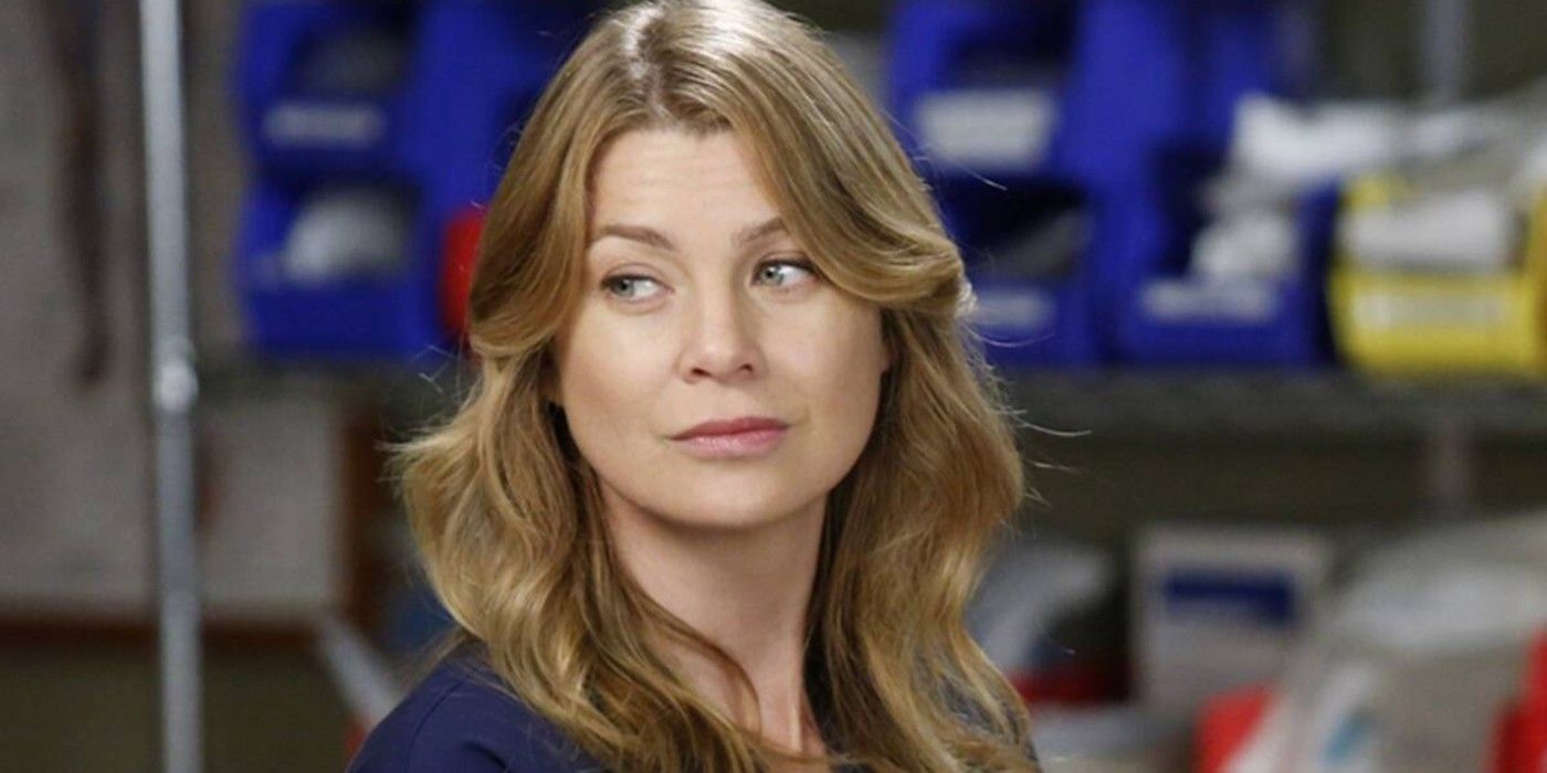 Meredith smirking at someone off-screen in Grey's Anatomy