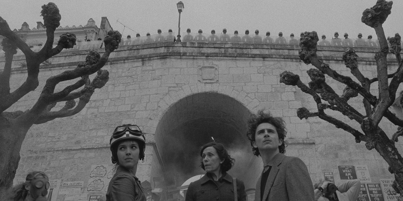 Lucinda, Zeffirelli, and Juliette stand by a bridge in The French Dispatch