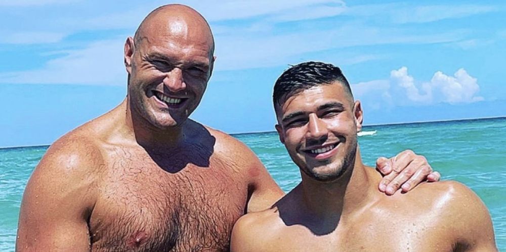 Tyson and Tommy Fury pose together topless