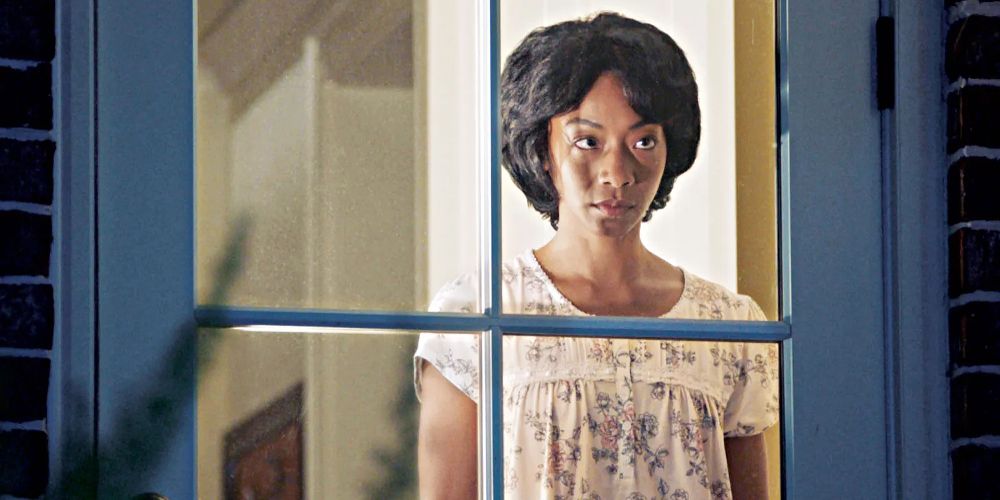 Georgina stands in the window in Get Out