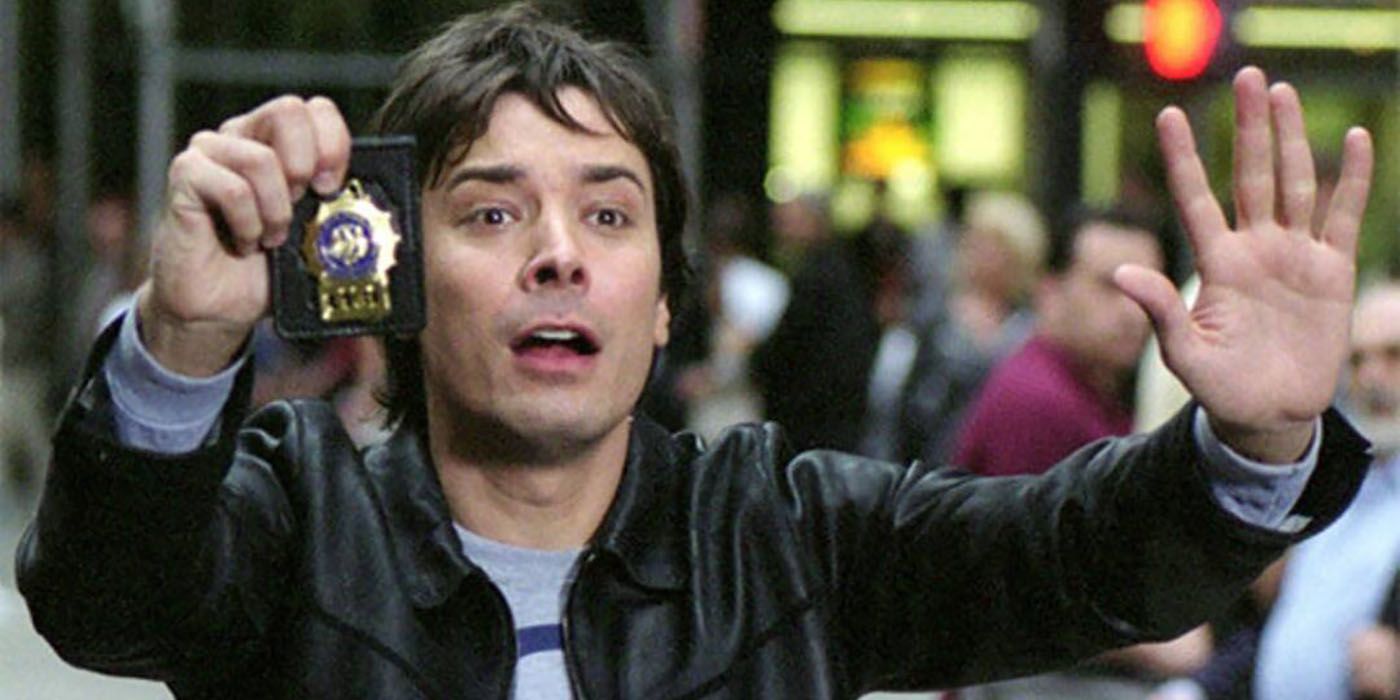 Jimmy Fallon with his hands out, holding a badge in a scene from Taxi.